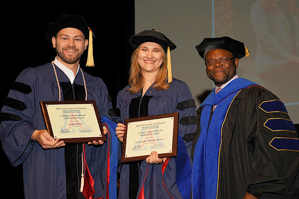 Students receiving awards during ceremony